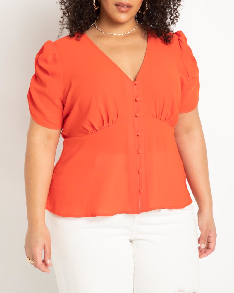 Front of a model wearing a size 14 Shirred Sleeve Top With Buttons in Red Orange by ELOQUII. | dia_product_style_image_id:290244